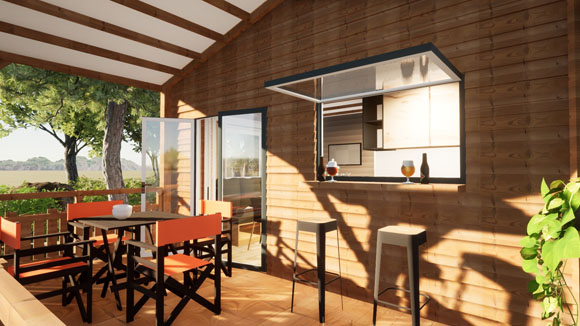 Cuisine d'été avec bar ouvrant sur la terrasse bois, concept convivial au camping Les Chamberts.